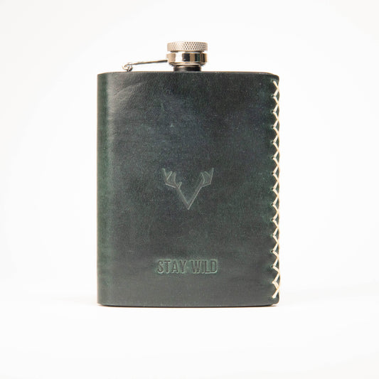 Close-up of hand-sewn saddle stitching on a leather hip flask